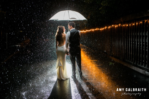 Rain on your wedding day is good luck! Especially if you get a photo like this!